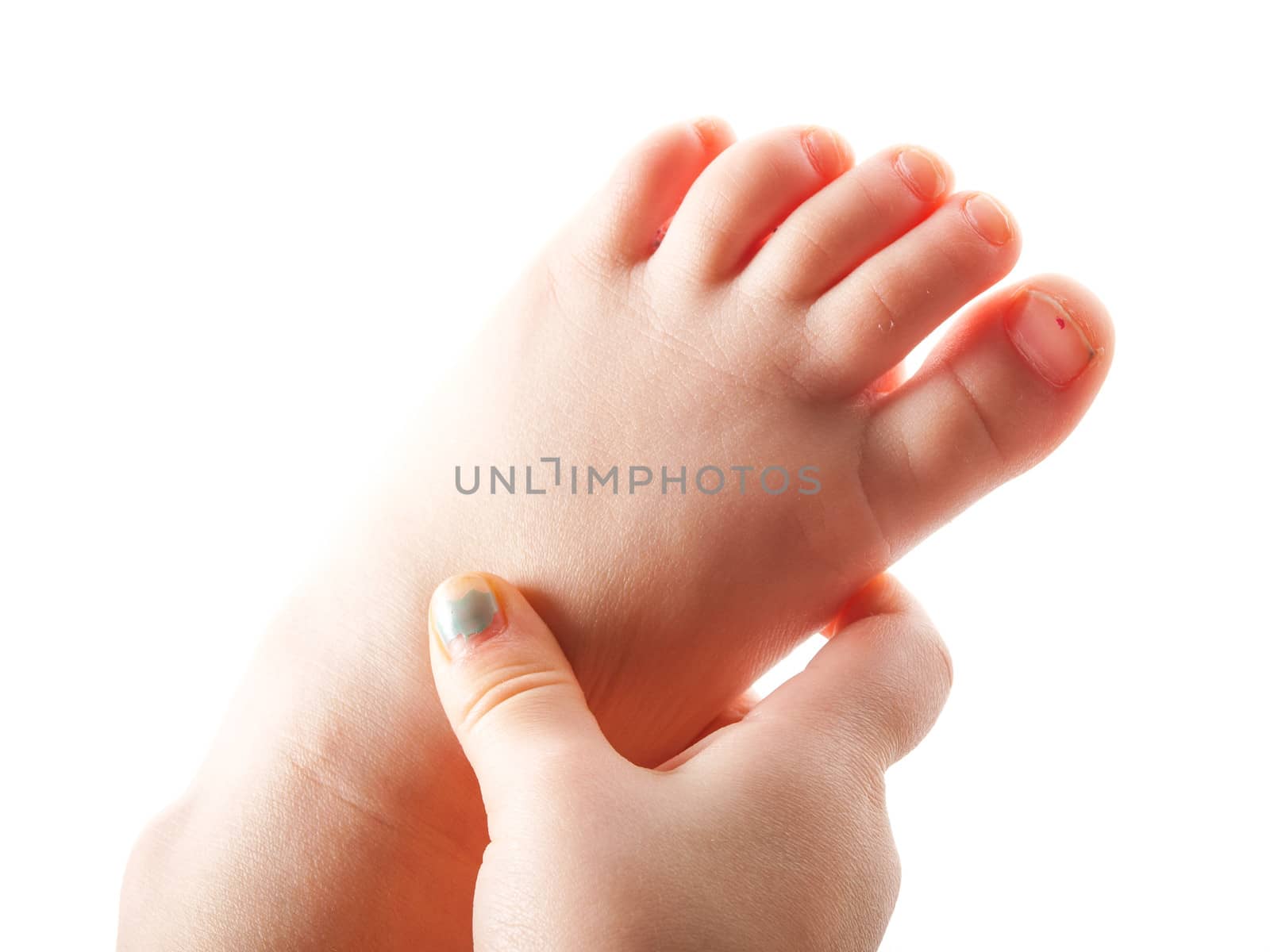 Girl grabbing left foot with right hand, isolated towards white background