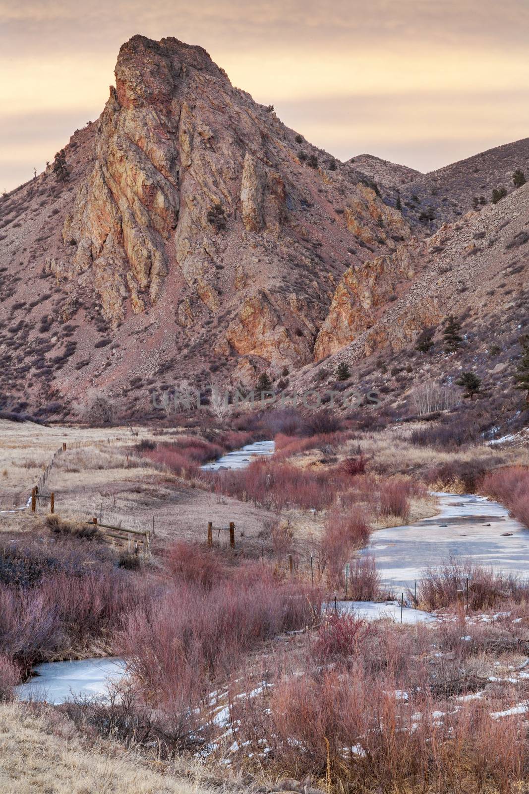 winter dusk in Rocky Mountains - Eagle Nest Rock and North Fork of Cache la Poudre River in northern Colorado near Fort Collins