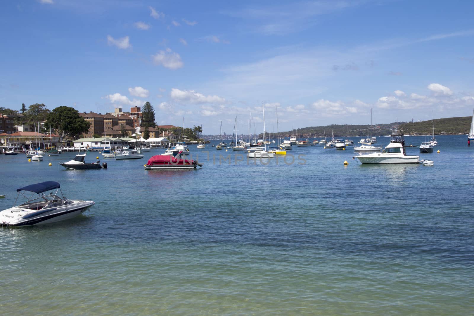 MANLY, AUSTALIA-DECEMBER 08 2013: Boats moored in Manly Cove. Manly is 11 miles north east of Sydney Central Business District in the Northern Beaches region.