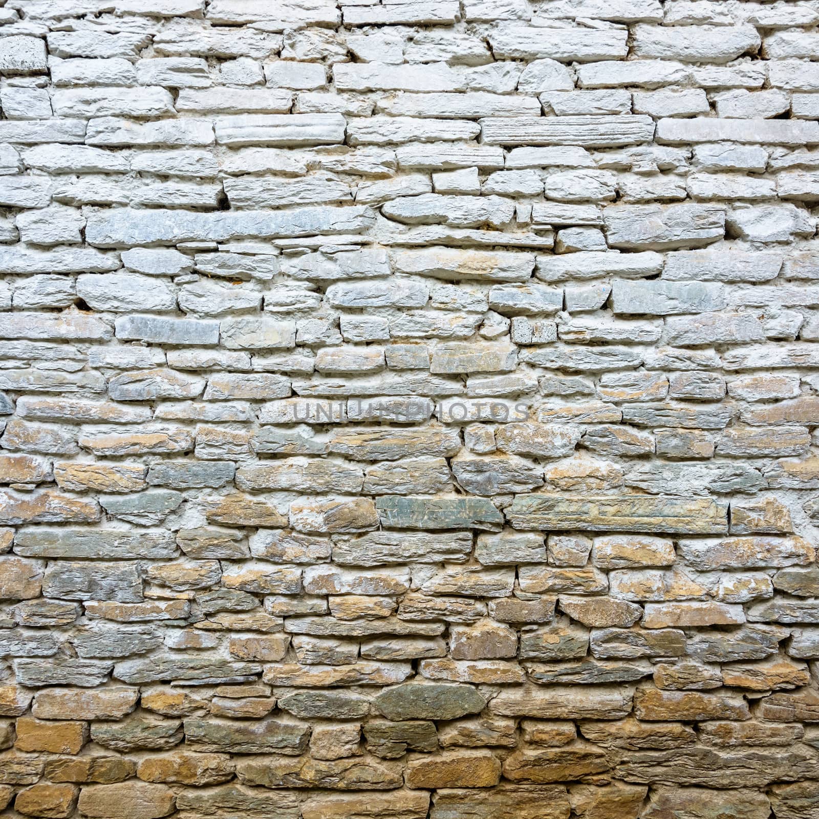 Whitewash old stone wall texture

