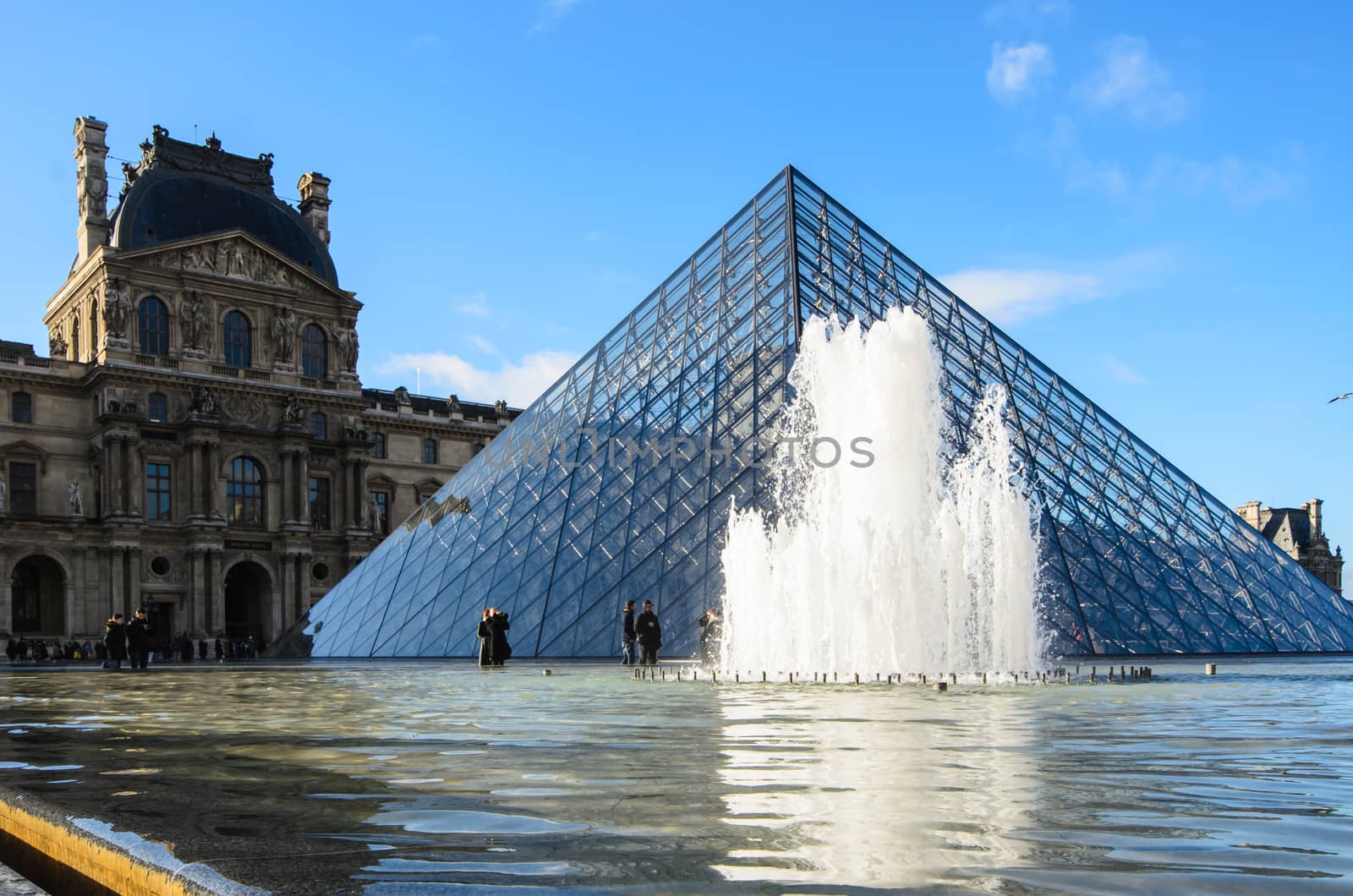PARIS-DEC 26: Louvre museum is a triangular pyramid for an art exhibit December 26, 2013 in Paris.