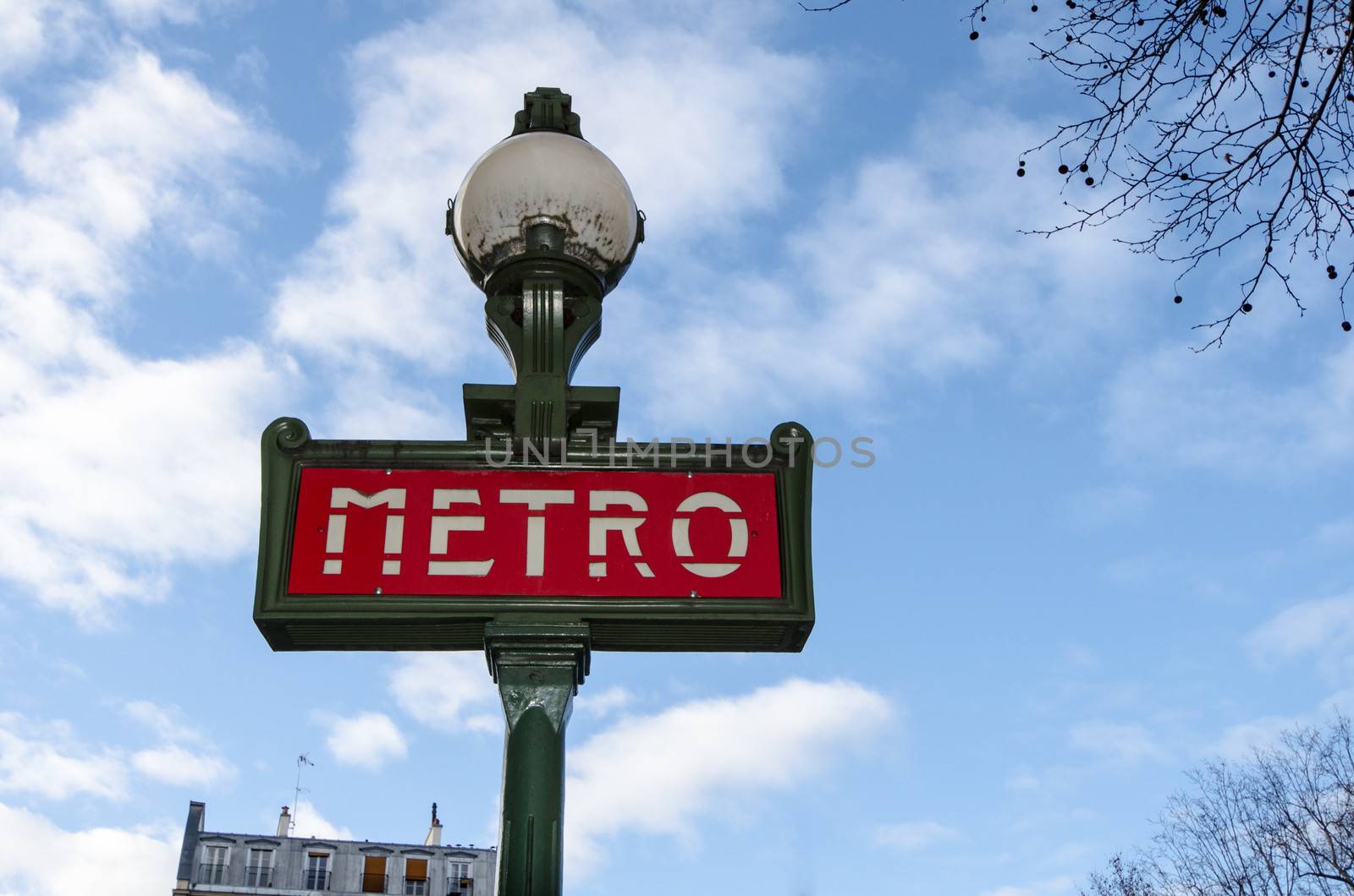 Metro Sign And Street Lamp In Paris
