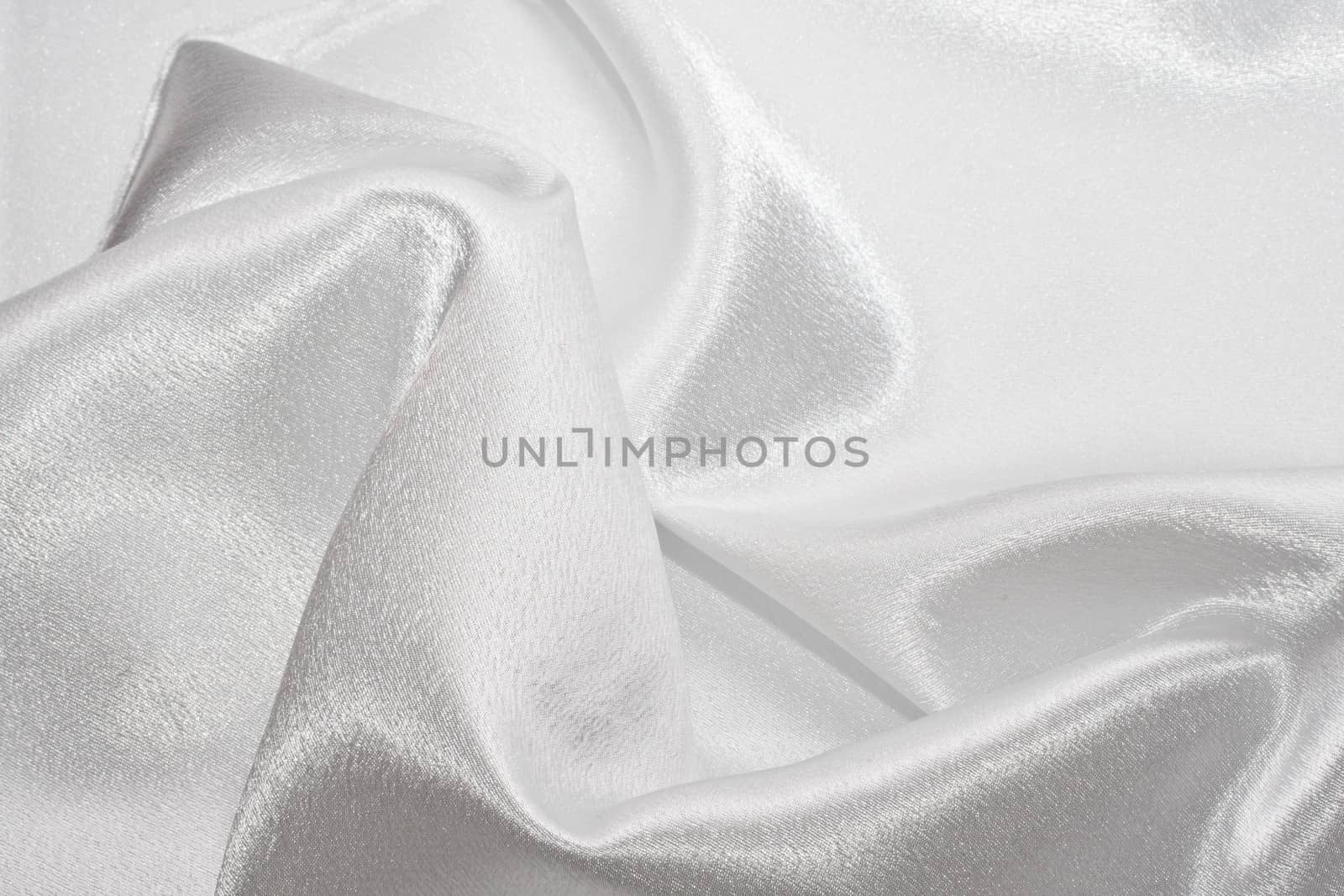 Abstract background white silk fabric with beautiful waves