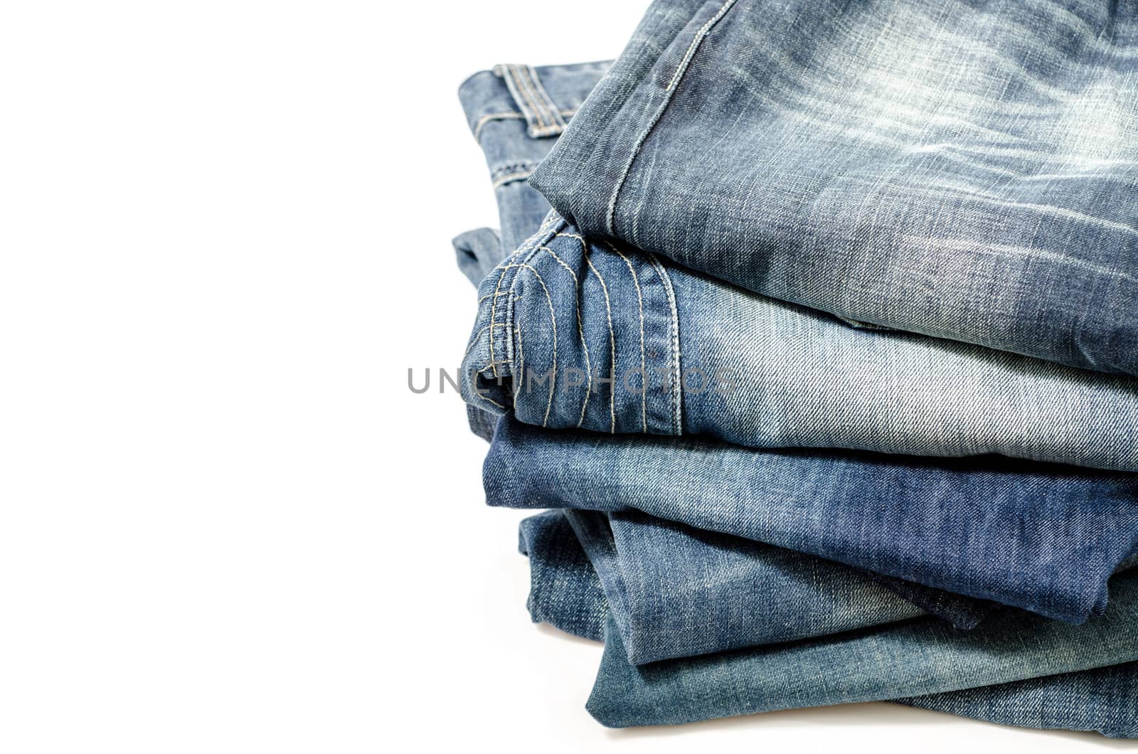 stack of blue jeans  by 9george