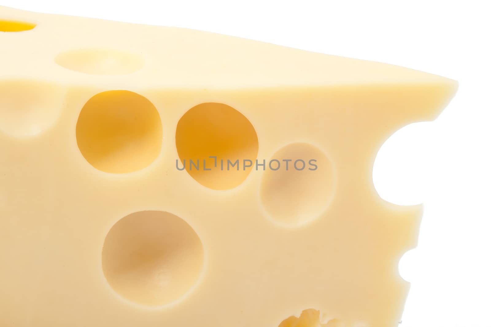 Piece of yellow cheese with holes, isolated on white background