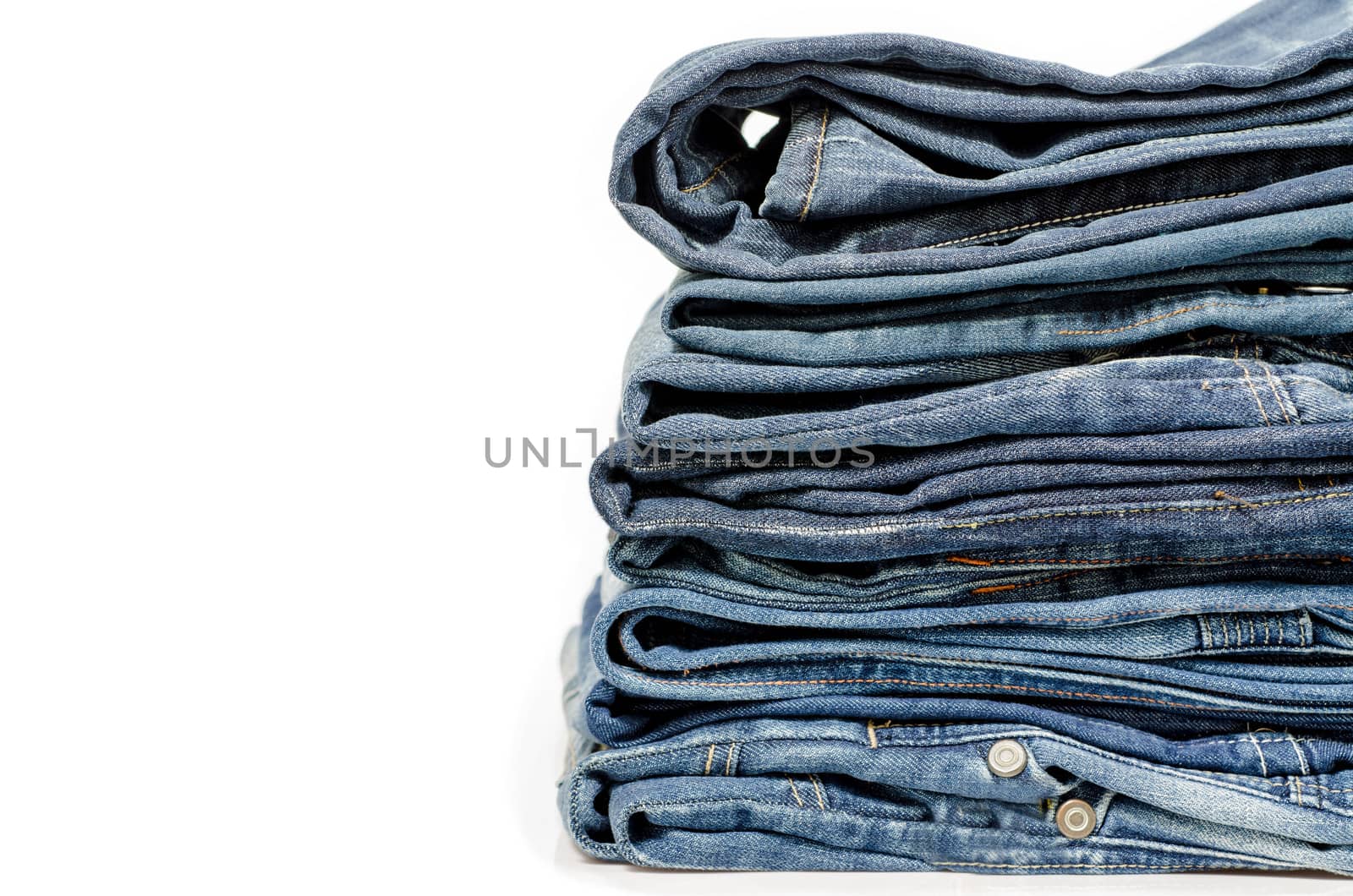 stack of blue jeans  by 9george