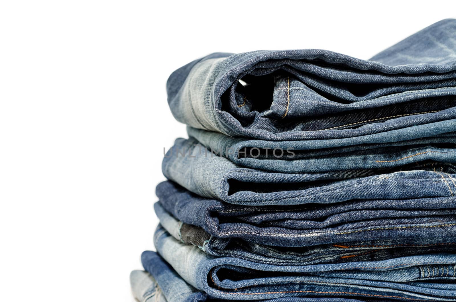 stack of blue jeans  by 9george