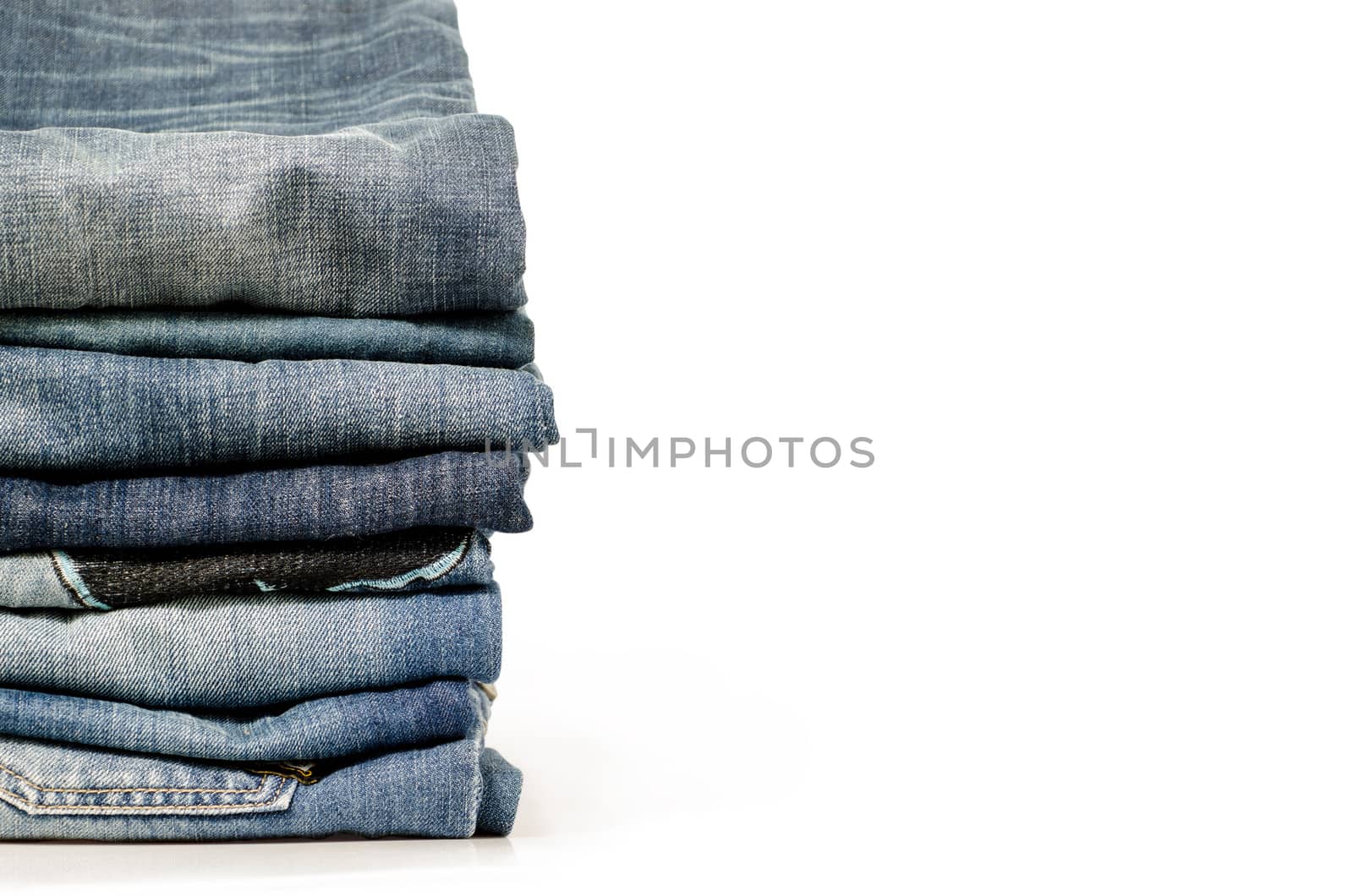 stack of blue jeans  by 9george