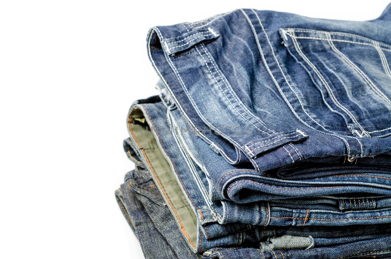 stack of blue jeans  by 9george