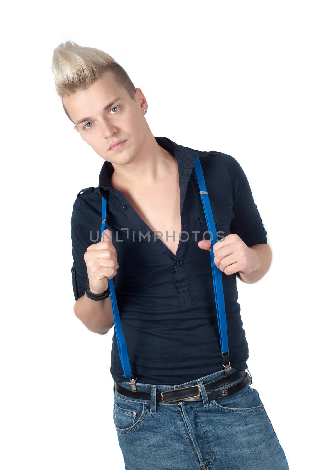 Portrait of handsome man dressed in shirt and jeans with braces