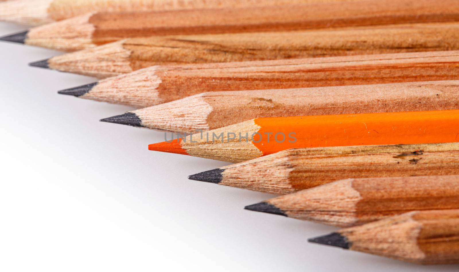 Color pencil stands out against a series of graphite pencils