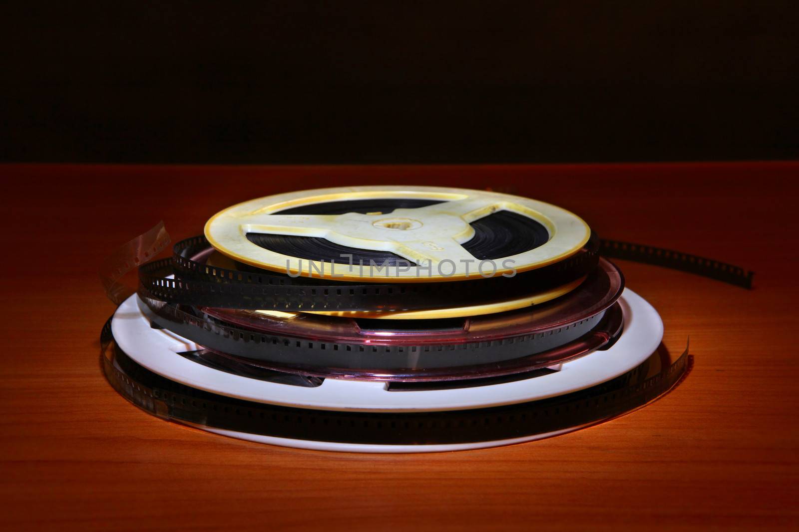 Old Film Reels on the Table in the Dark room