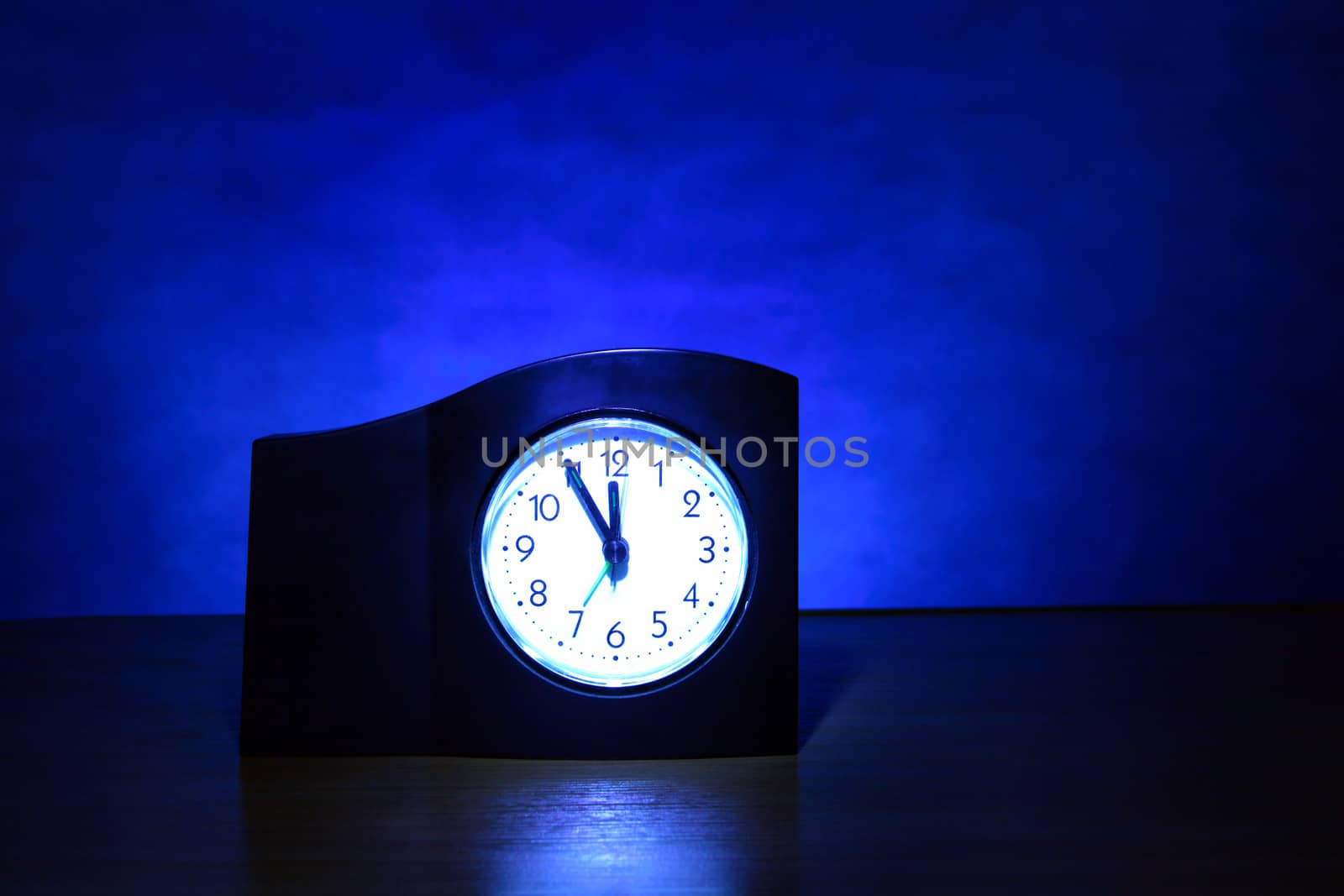 Clock in the Dark Room with display Almost Midnight