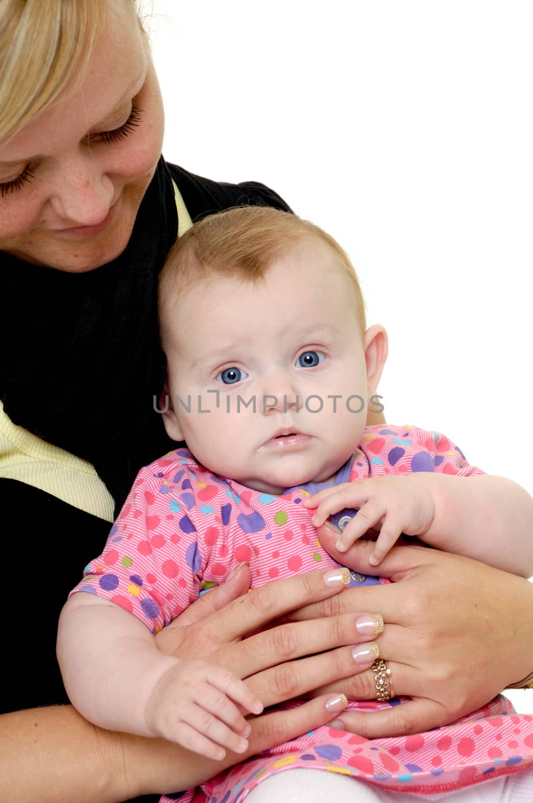 Mother is looking down on her sweet baby. Taken on a white background.