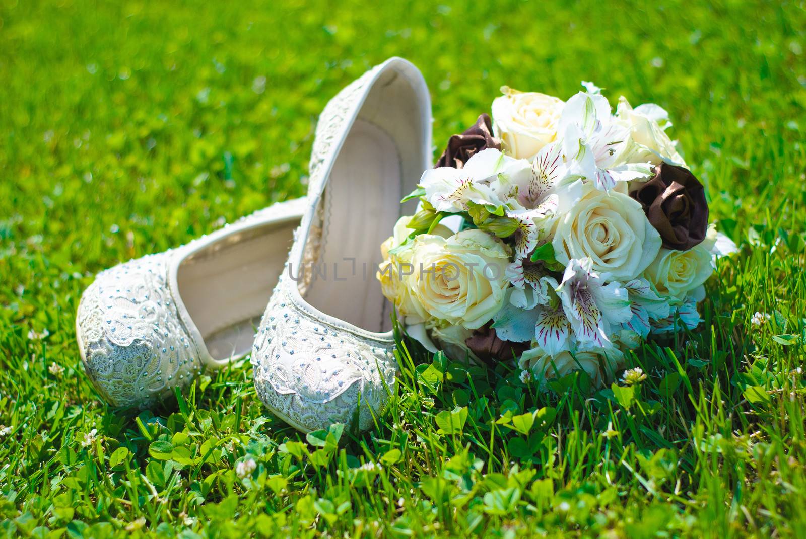Bridal bouquet on a green meadow