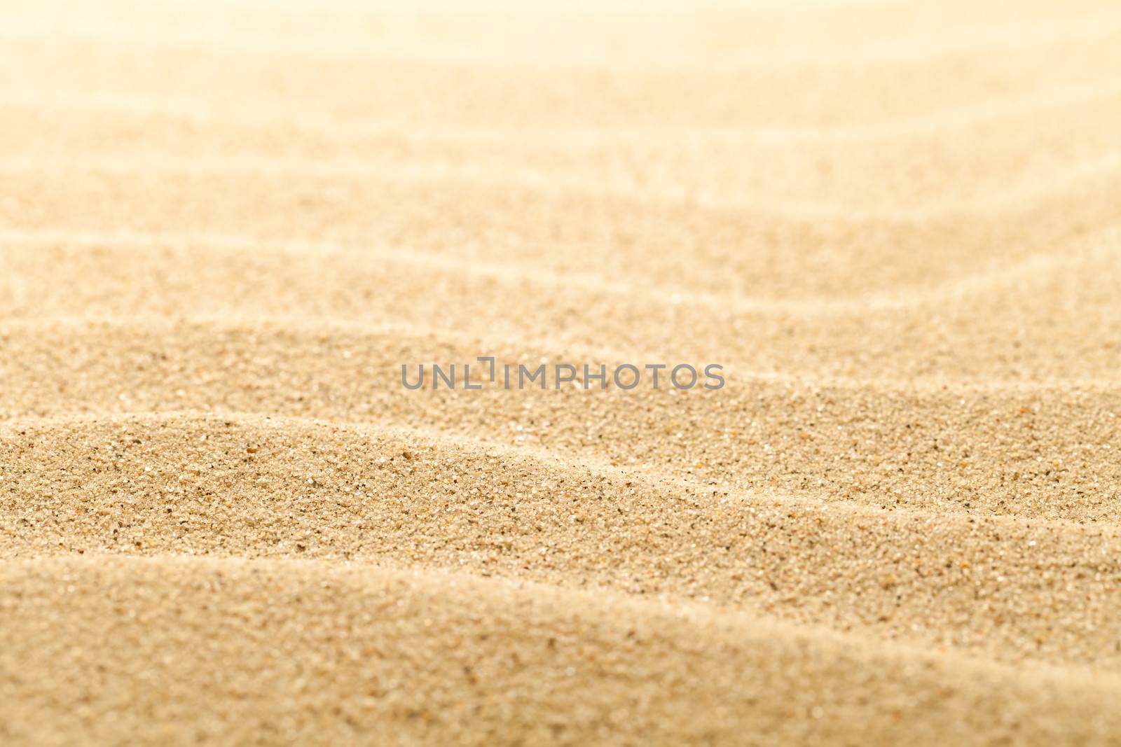 Sandy beach background for summer composition. Sand texture. Macro shot. Copy space