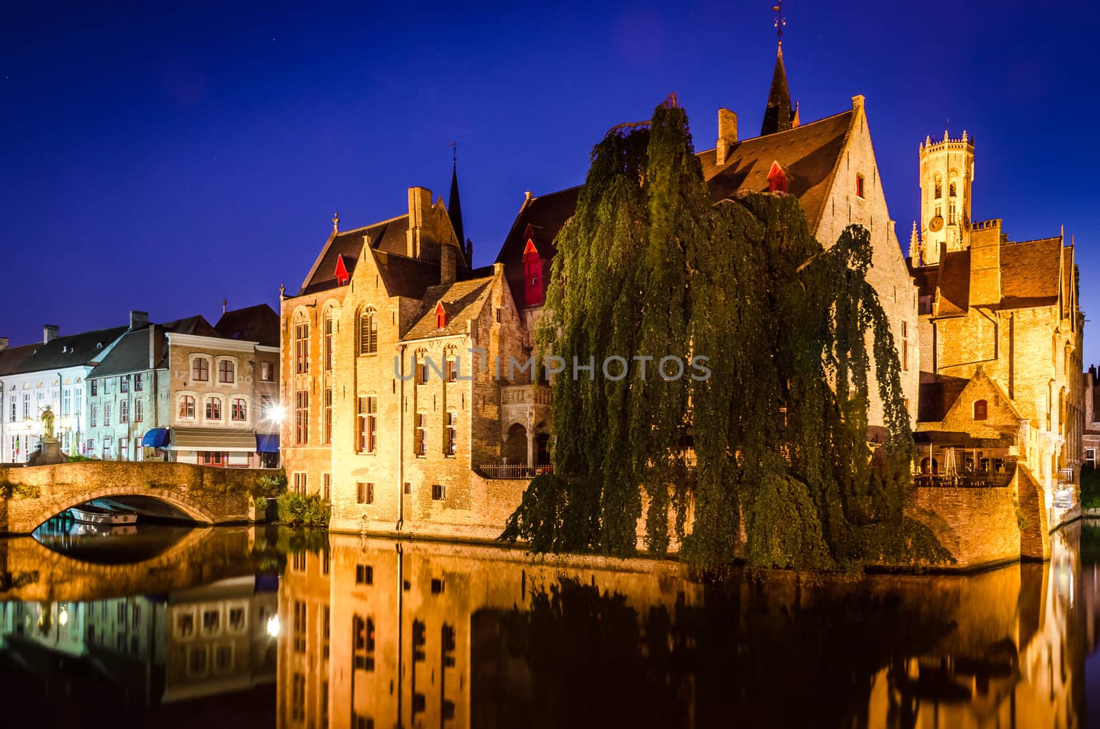 Scenic night view of river canal and medieval houses, Bruges, Belgium