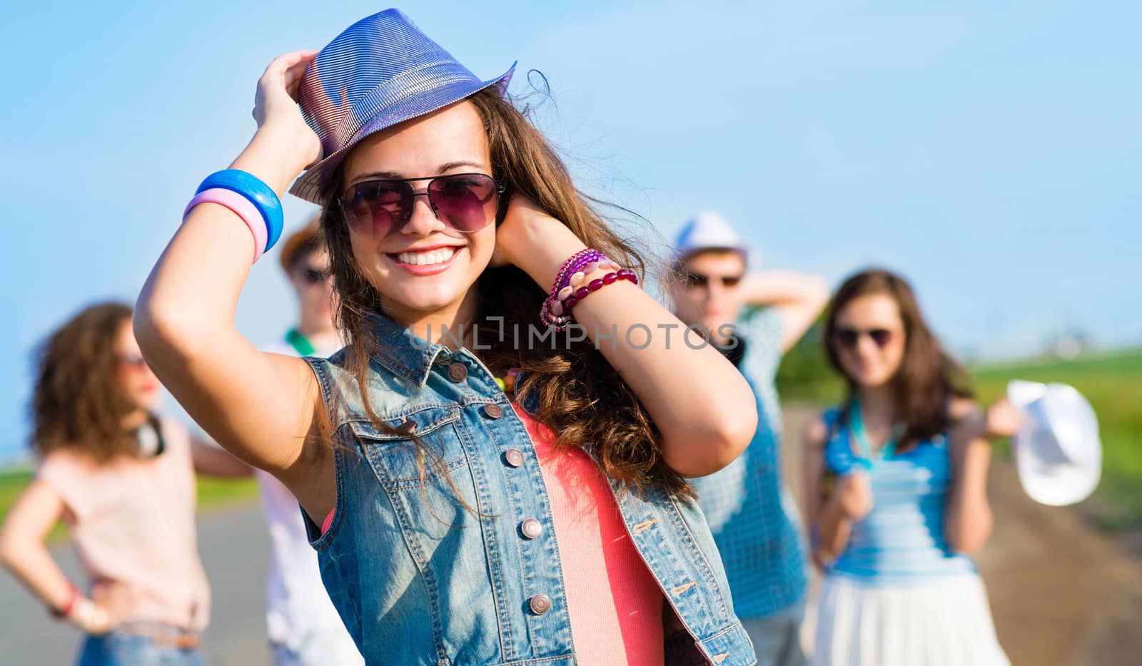 stylish young woman in sunglasses by adam121