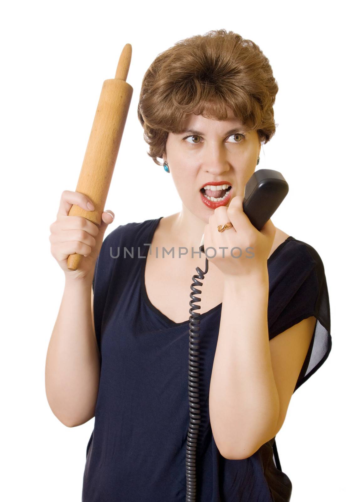 Woman with a rolling pin on the phone screaming isolated on white background