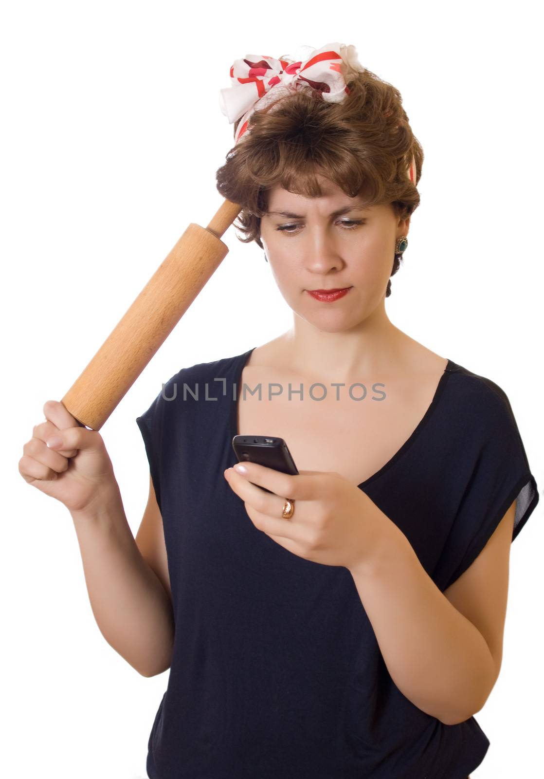 Woman checking telephone of her man with a rolling pin in her hand