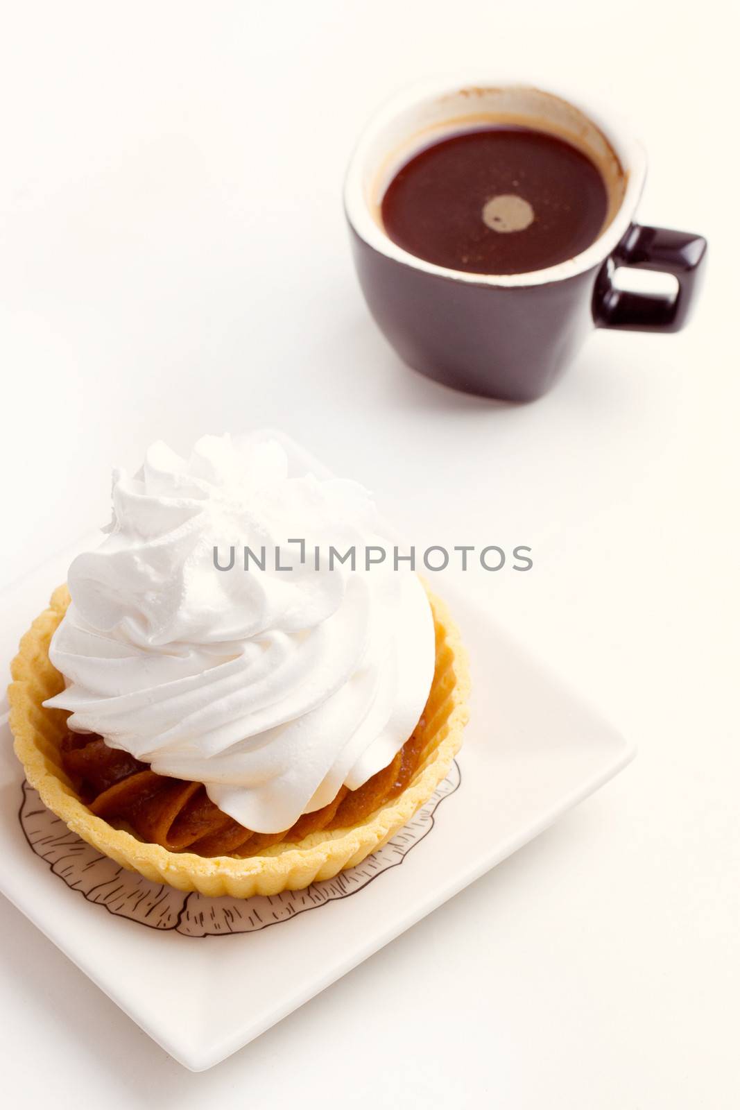 Cake with whipped cream and black coffee