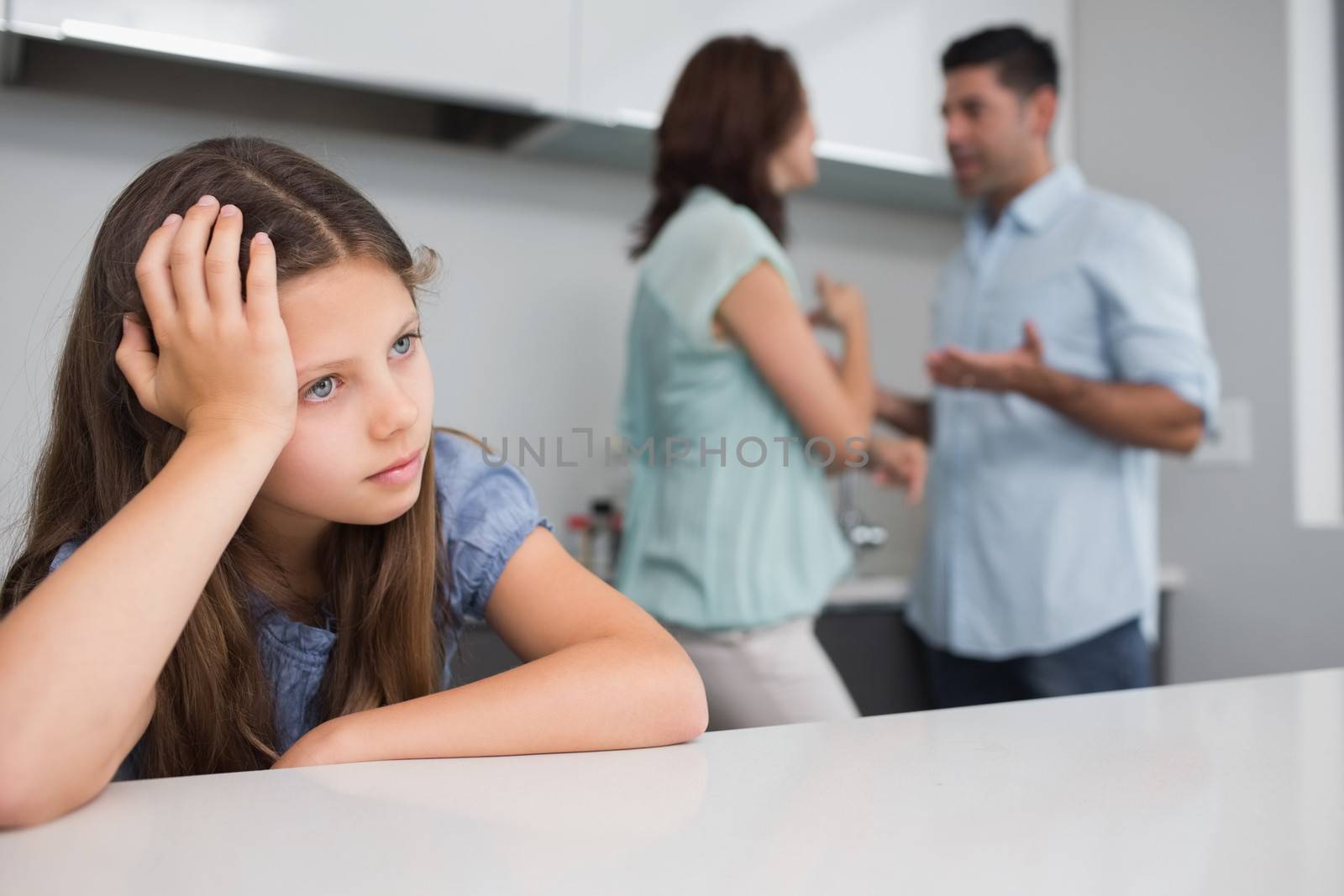 Closeup of a sad girl while parents quarreling by Wavebreakmedia