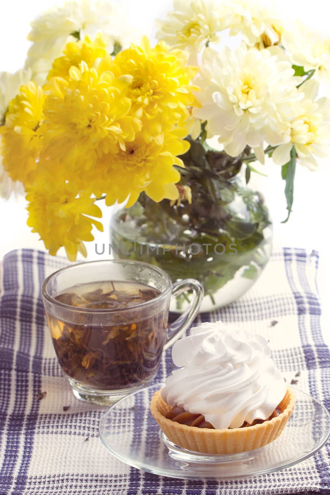 Romantic breakfast. Tea, cake, yellow chrysanthemum