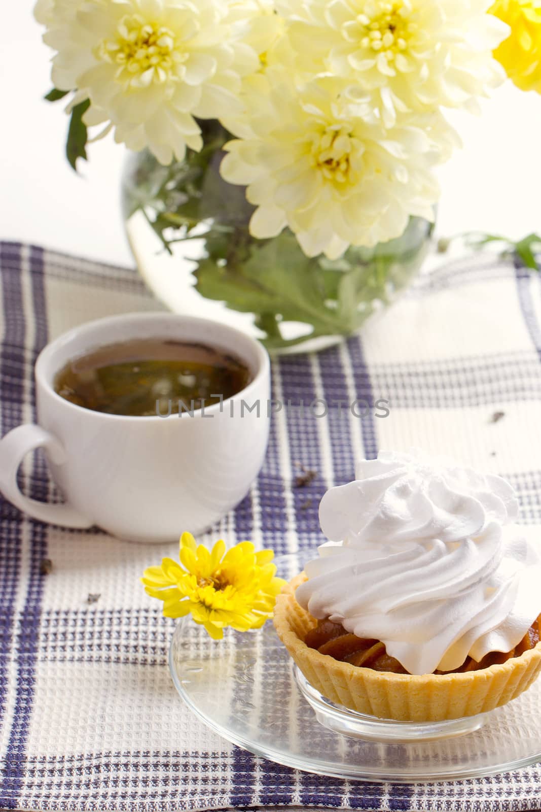 Romantic breakfast. Tea, cake, yellow chrysanthemum