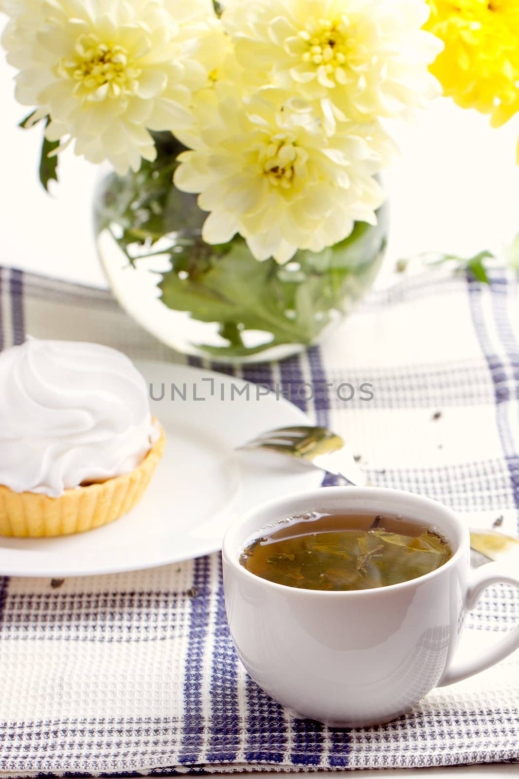 Romantic breakfast. Tea, cake, yellow chrysanthemum