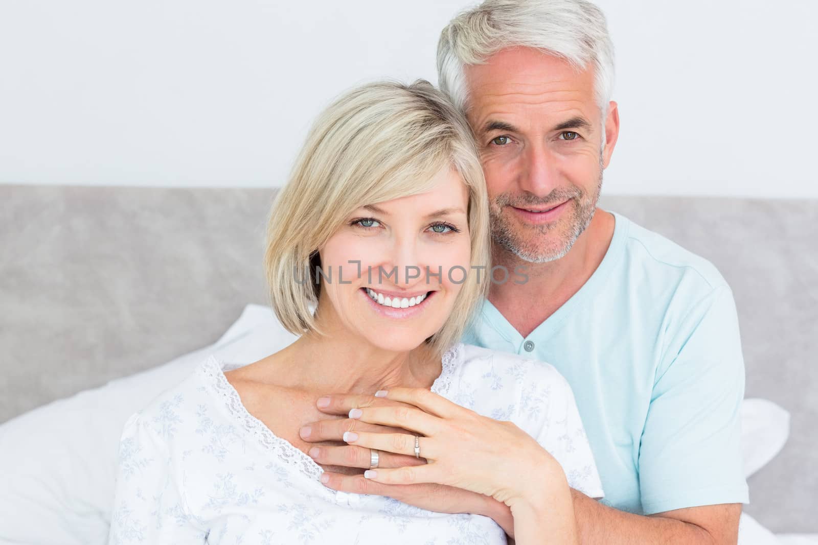 Portrait of a loving mature couple in bed by Wavebreakmedia