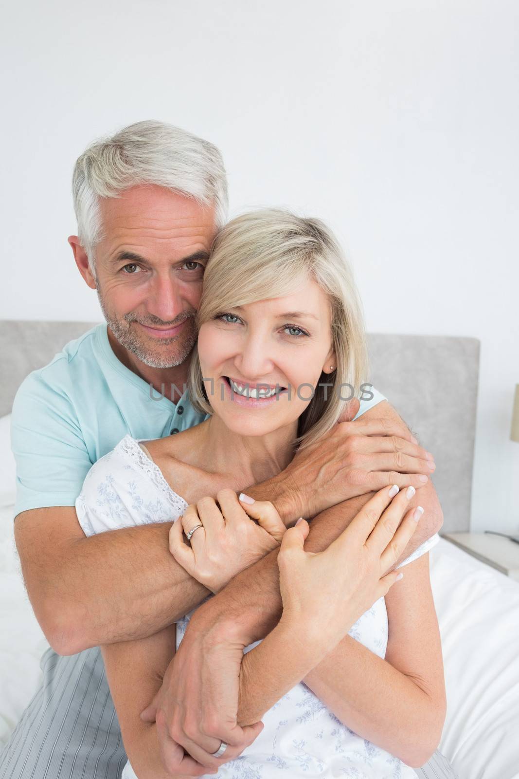 Portrait of a loving mature man embracing woman by Wavebreakmedia