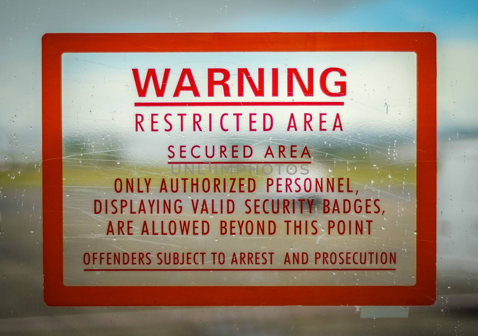 A Red Airport Security Restricted Area Warning Sign