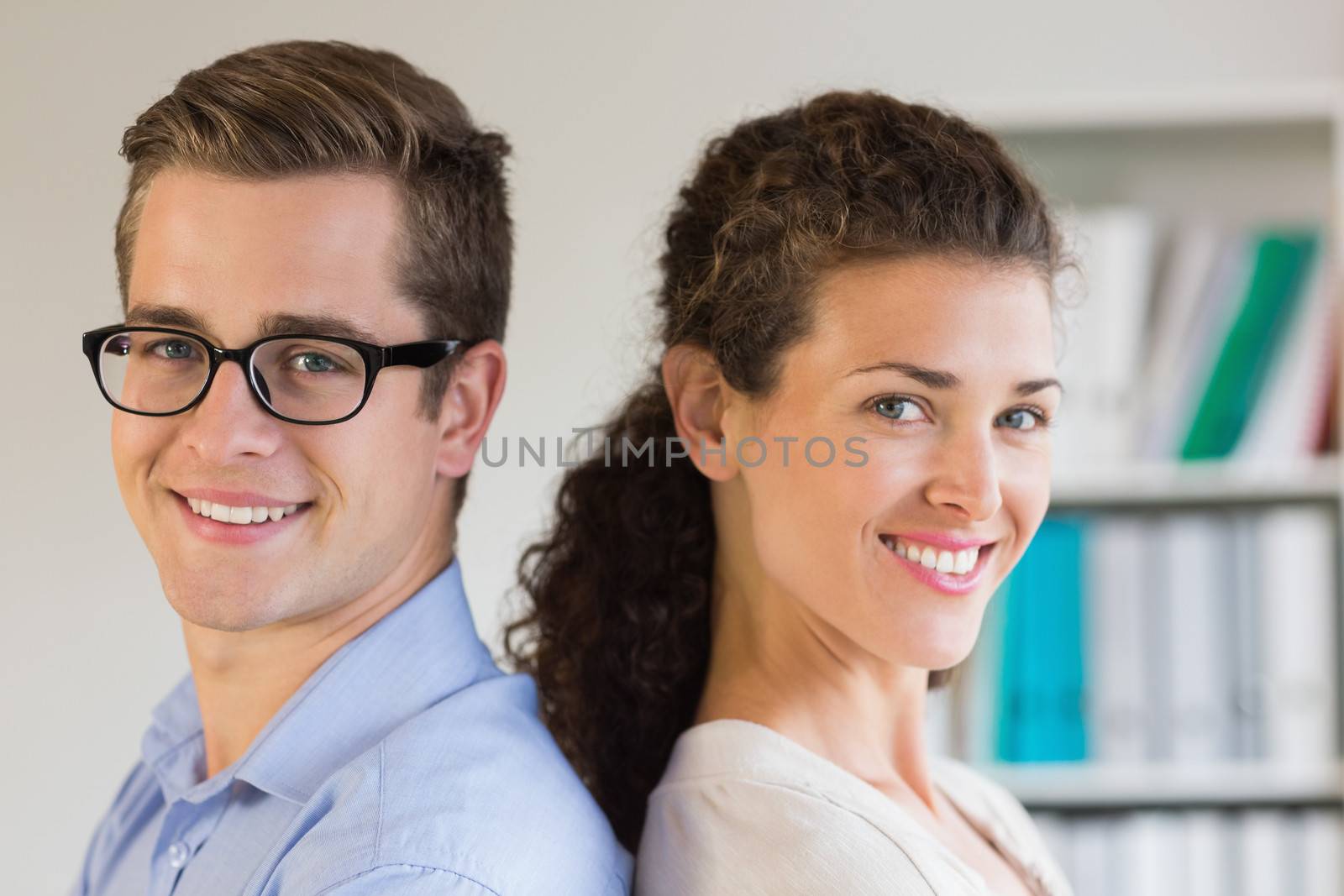 Closeup portrait of smiling business people in office