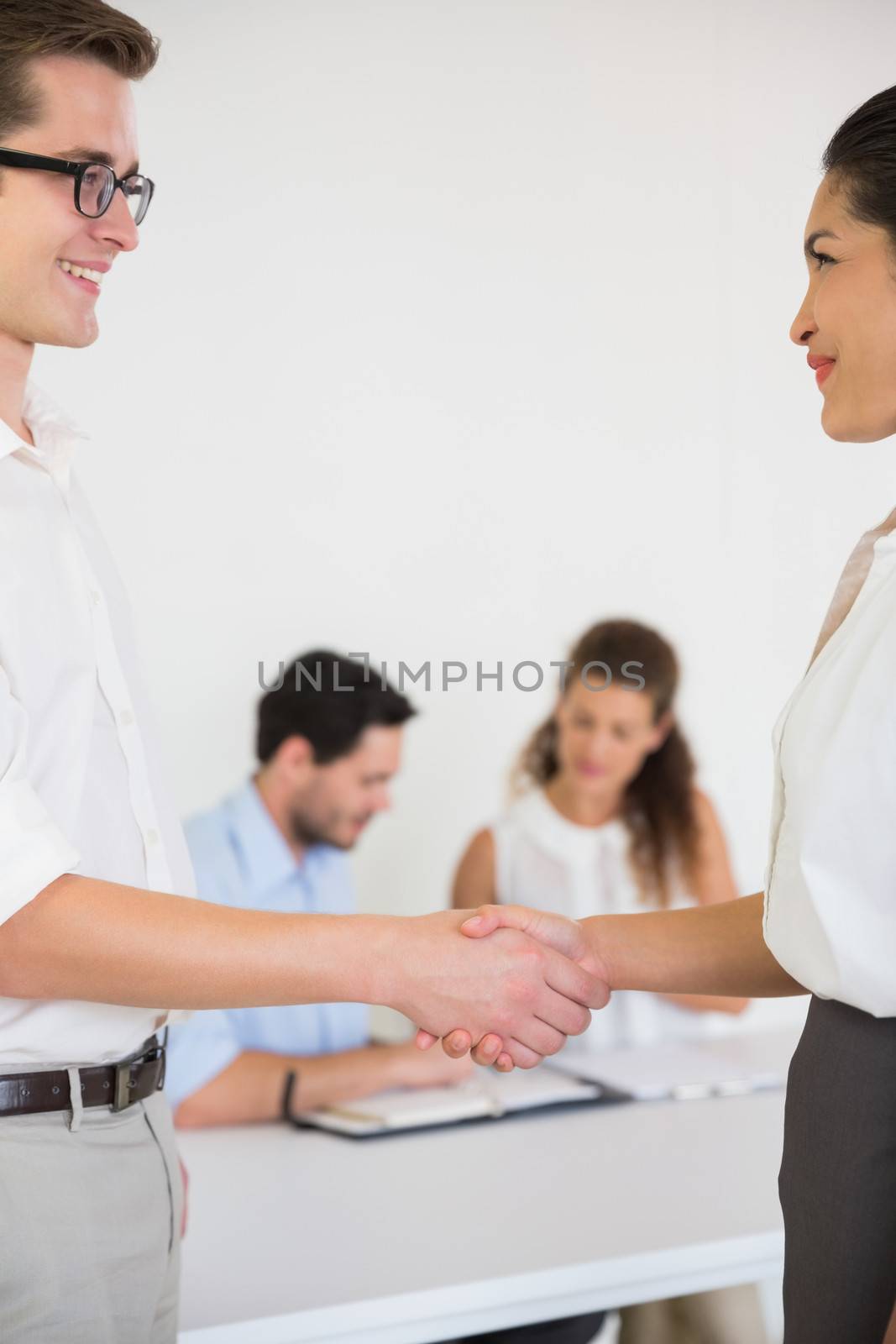 Business people greeting each other by Wavebreakmedia