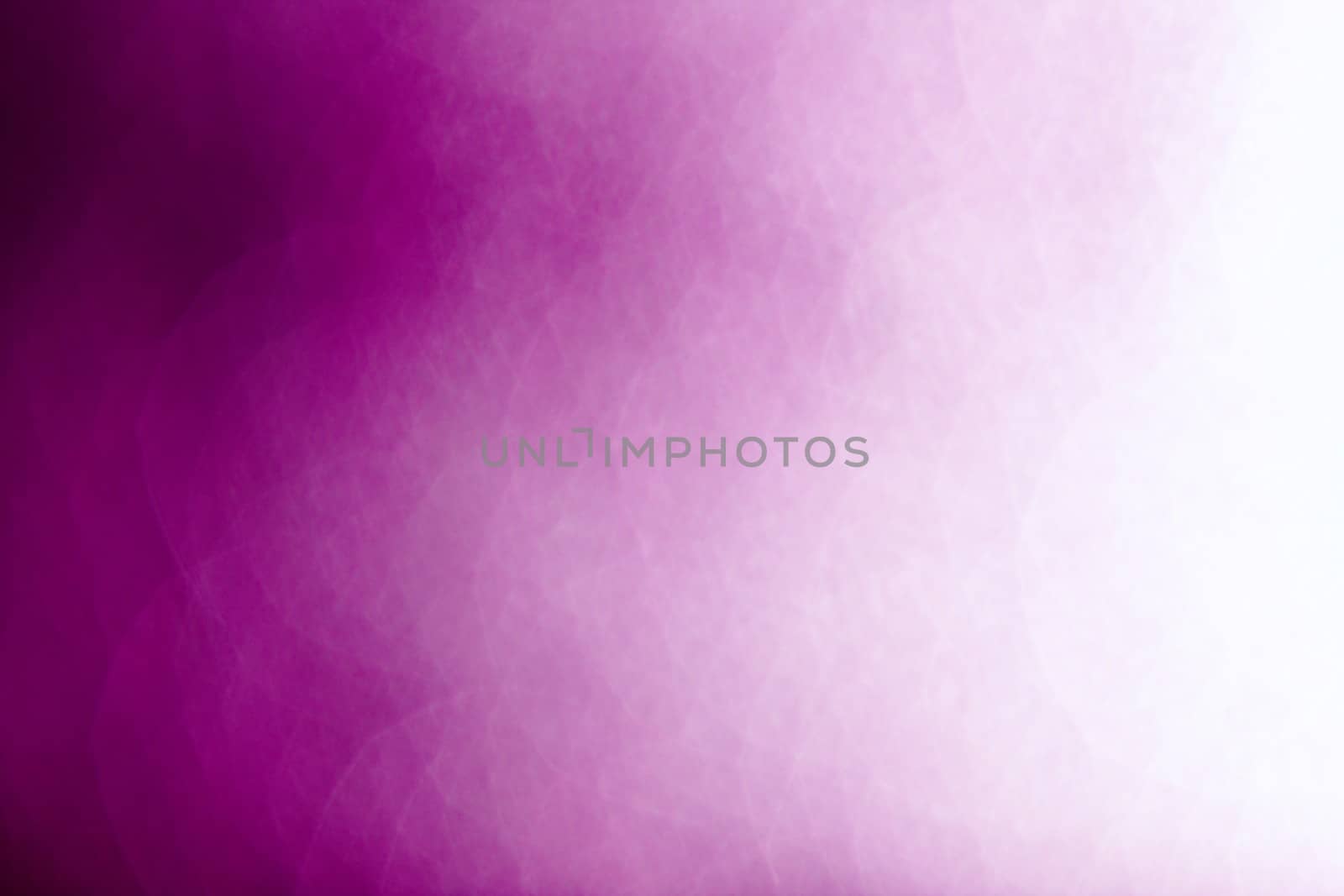 Purple abstract background of defocused highlights