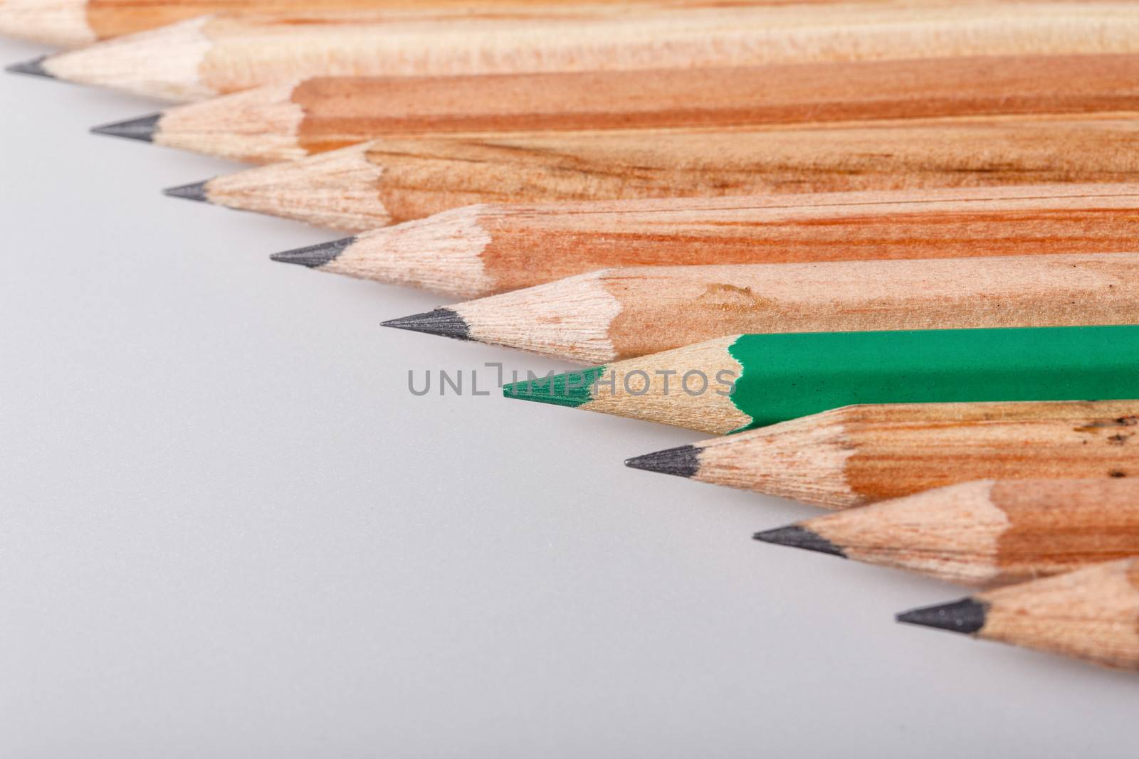 Color pencil stands out against a series of graphite pencils