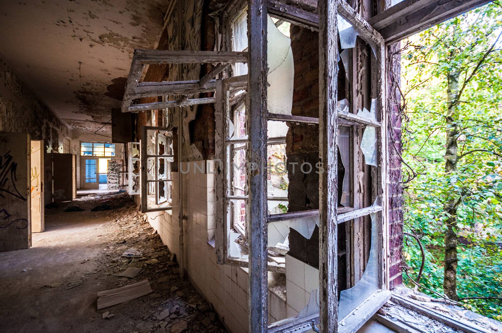 Long corridor in an abandoned dirty building