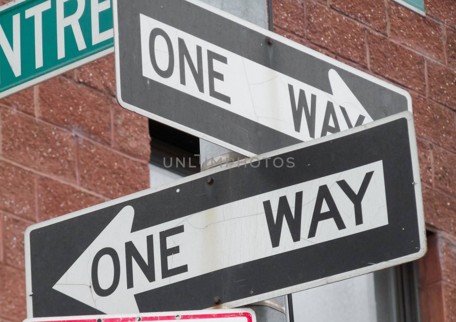 two road signs for One way streets