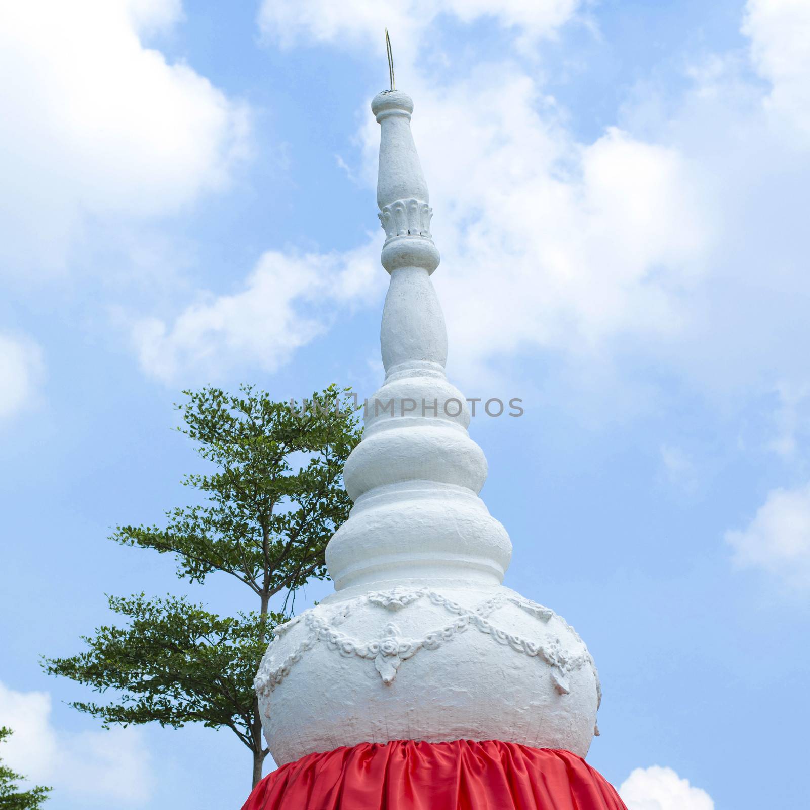 white stppa temple in thailand on sky background