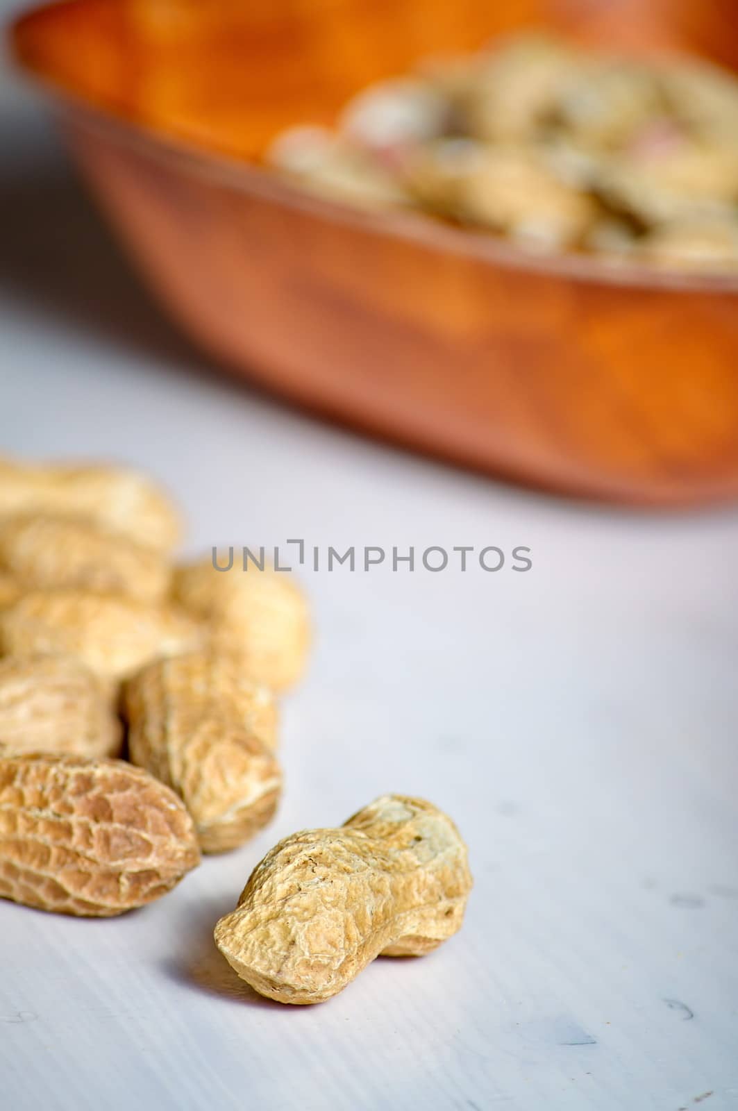 Peanuts in a brown bowl by anderm
