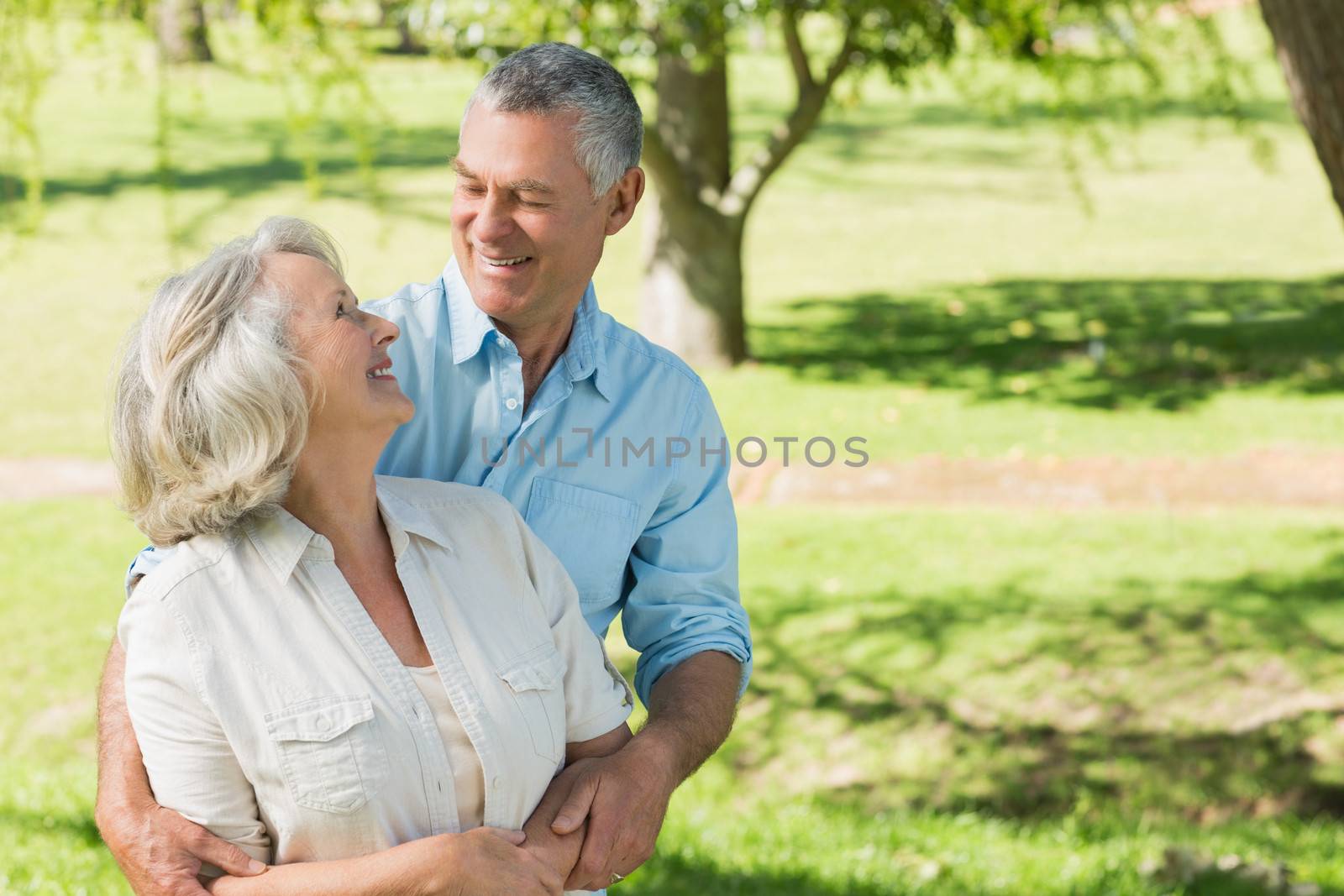Portrait of a loving and happy mature couple at a summer park