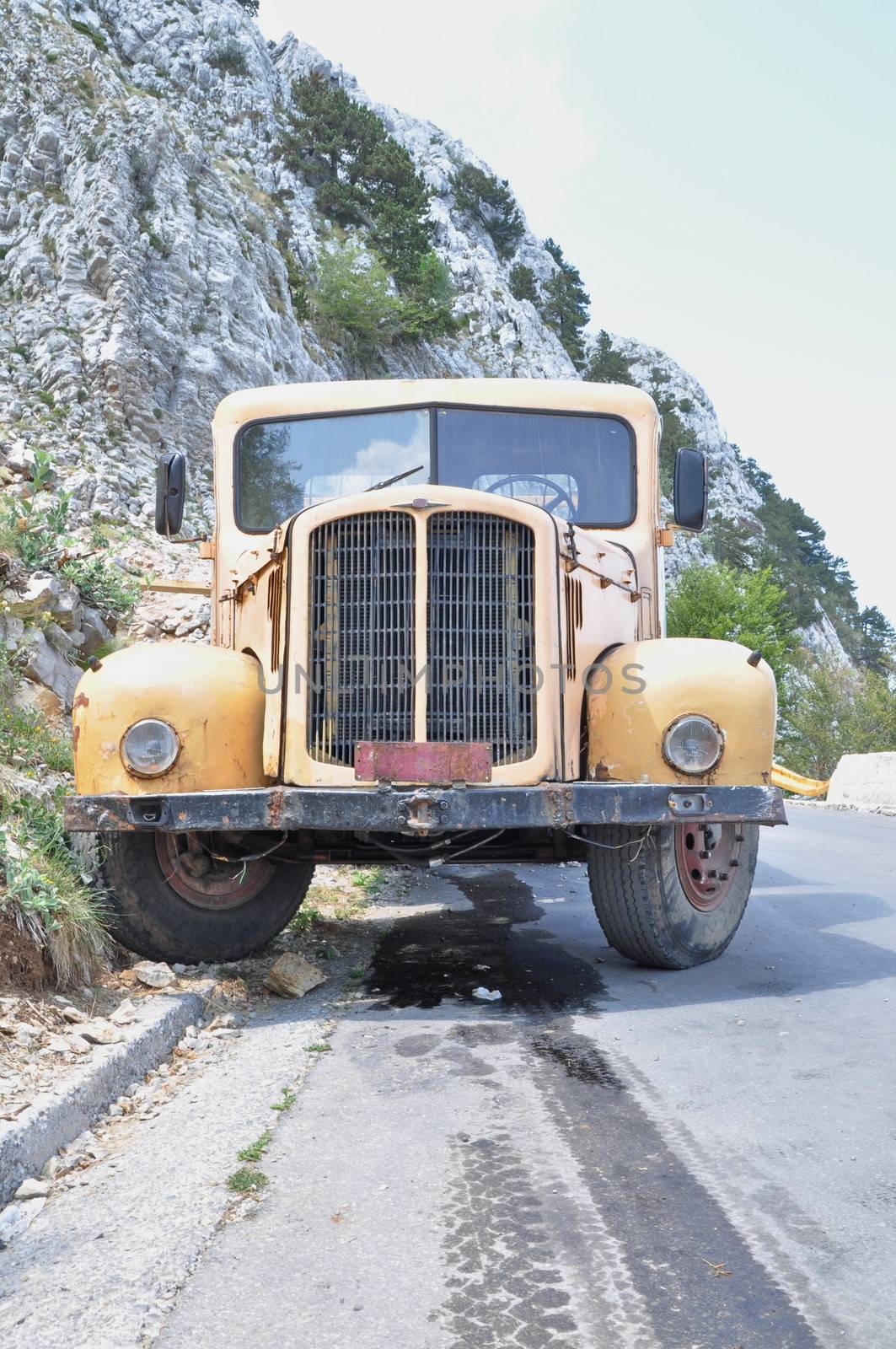 Yellow old truck in the mountain by anderm