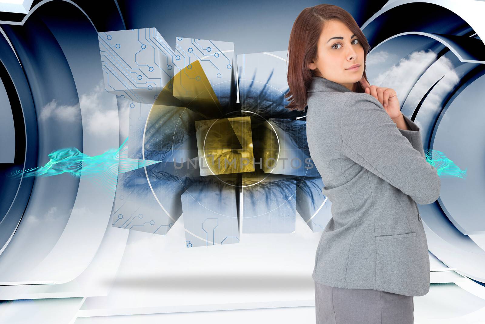 Concentrating businesswoman against abstract blue cloud design in futuristic structure