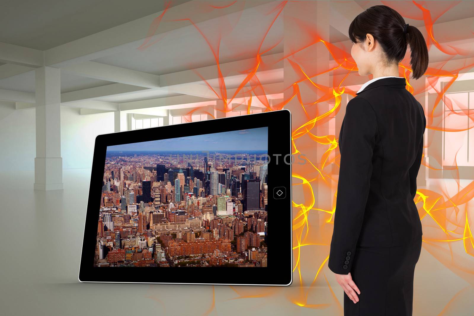 Composite image of businesswoman standing by Wavebreakmedia