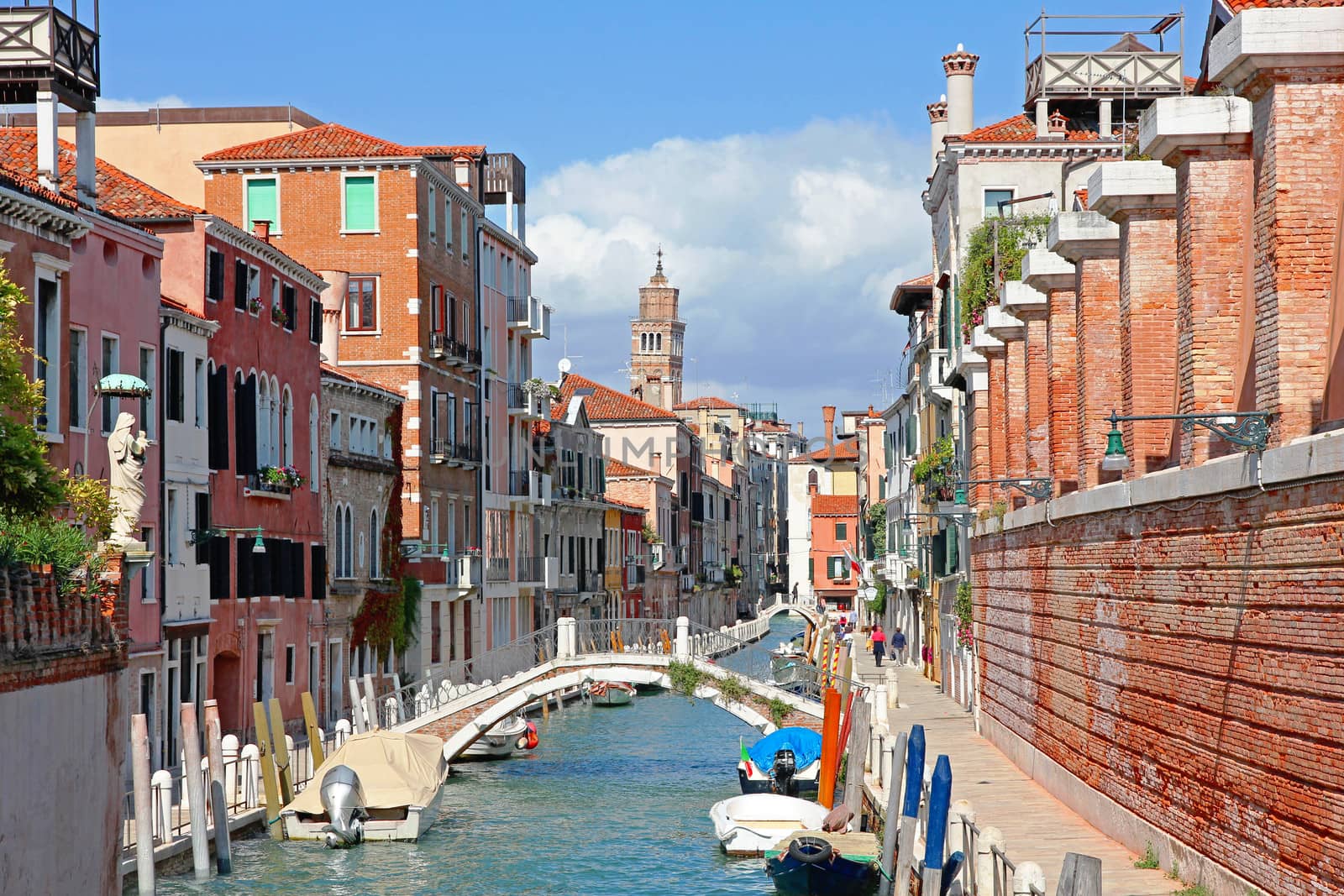 Italy. Venice. Romantic canal with bridge among old colorful houses 