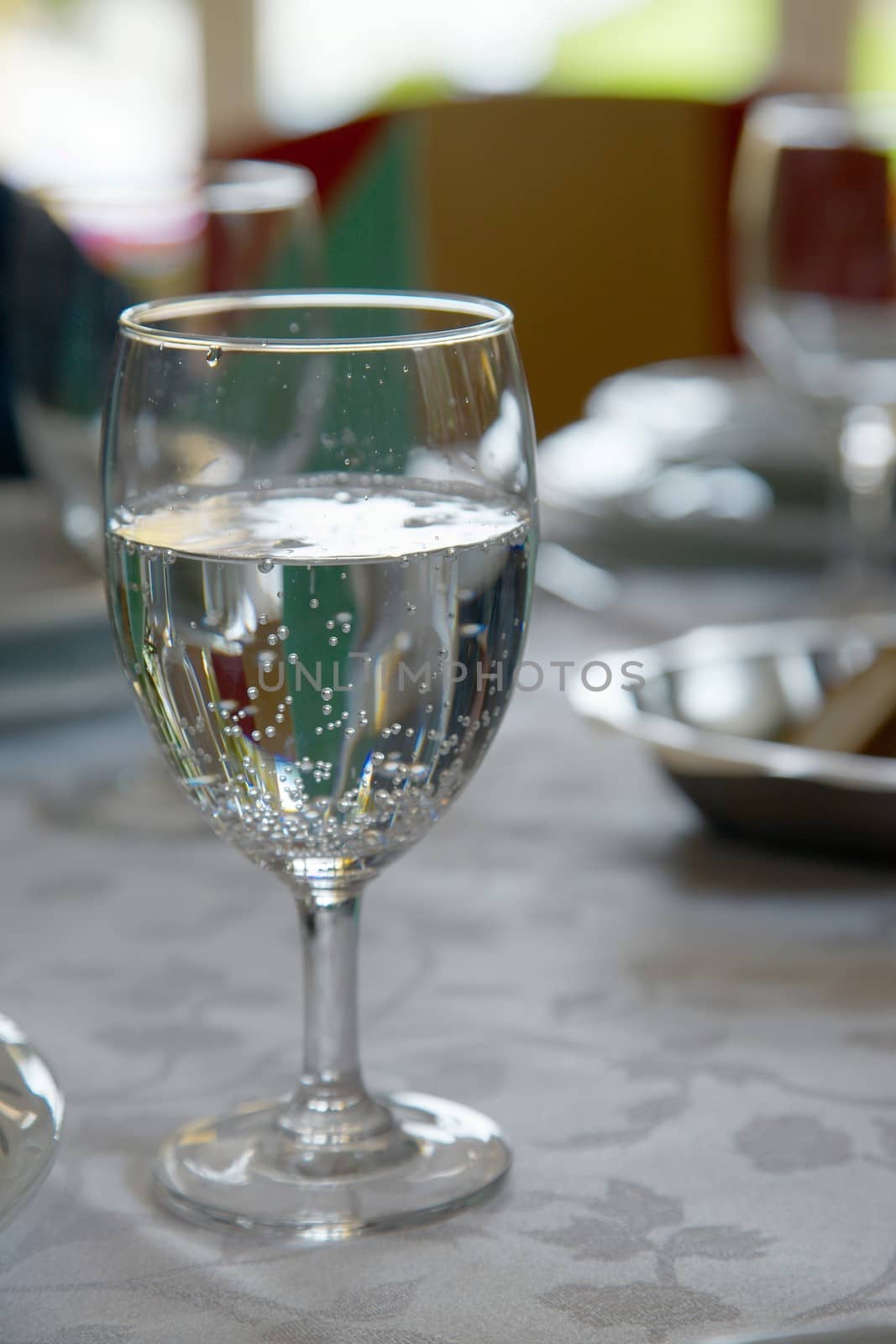 Pouring water into a glass in a restaurant