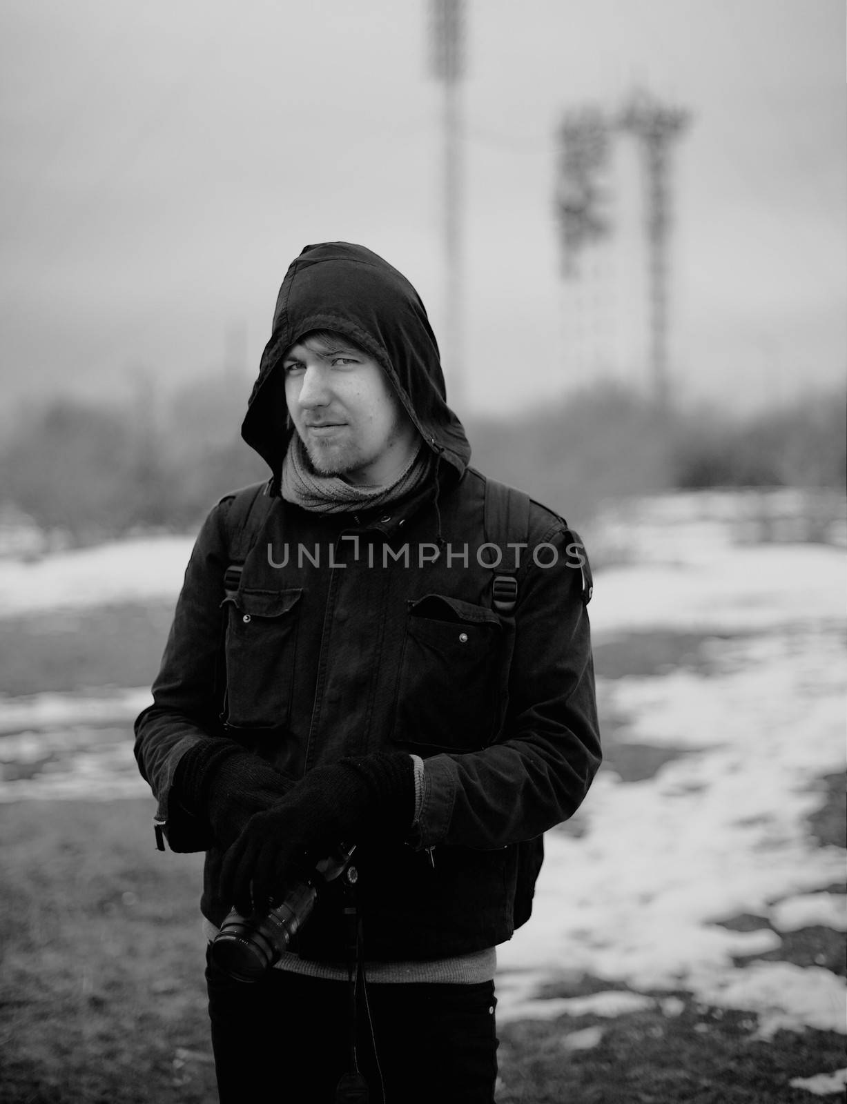 Outdoor photographer portrait in misty weather, black and white