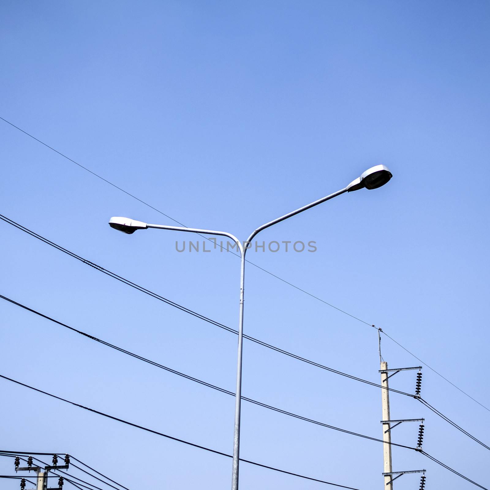 street light and Electricity post on blue sky