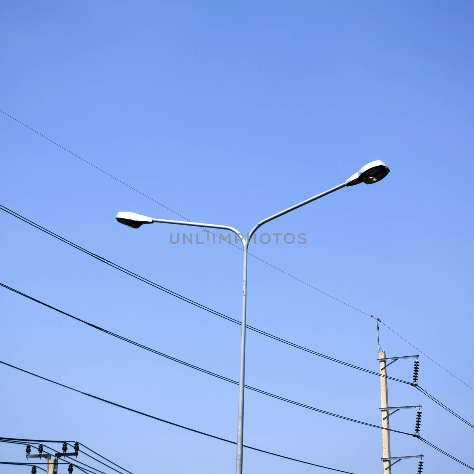 street light and Electricity post on blue sky by ammza12