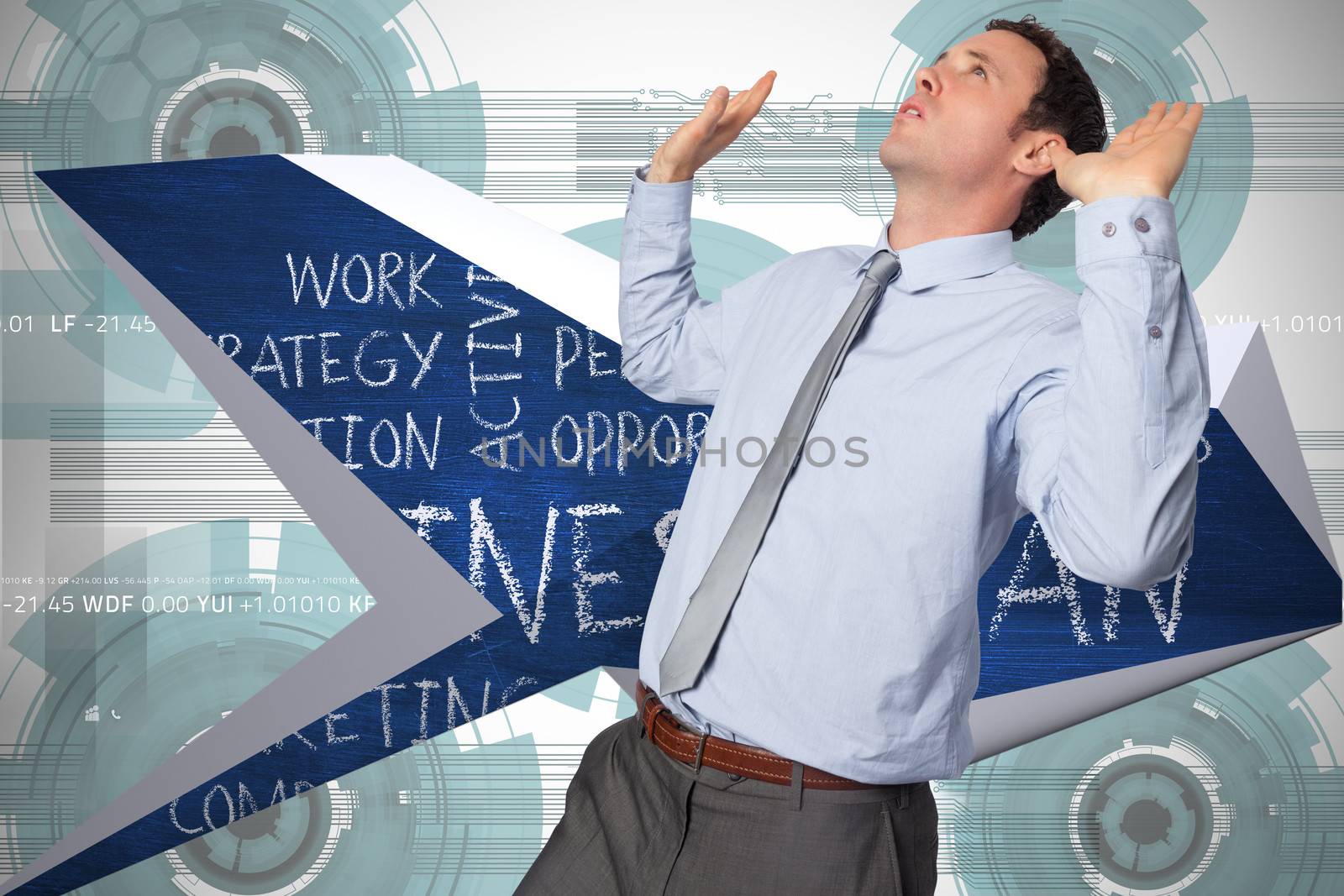 Businessman standing with arms pushing up against technology wheel background